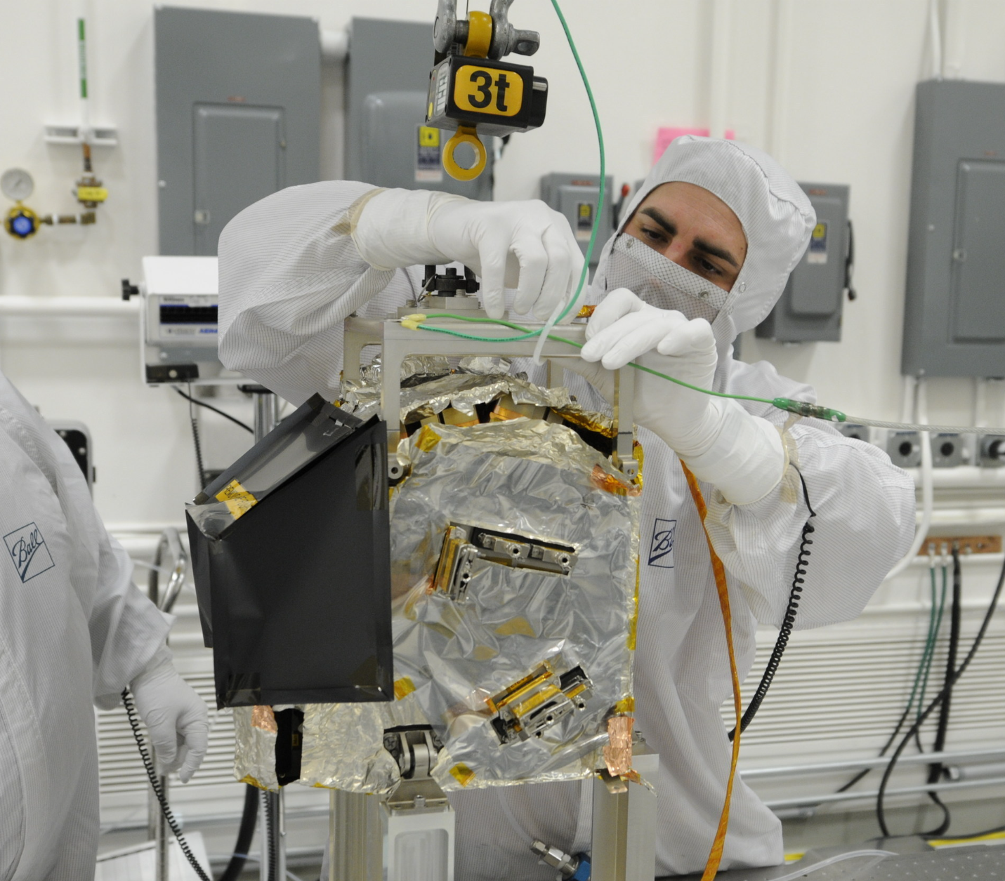 A Ball Aerospace employee works on the JPSS-1/NOAA-20 satellite with a 3-ton wireless Ron 2501 dynamometer